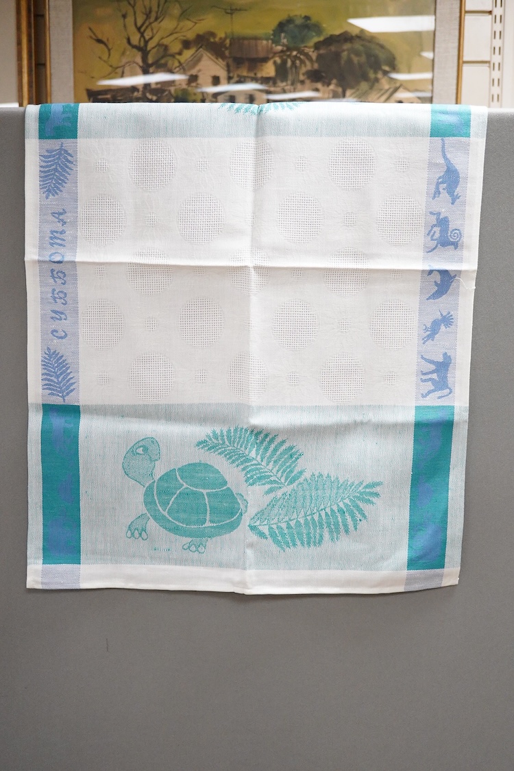 A collection of late 20th century damask cloth napkins woven in bold pinks and blues, together with later butterfly seersucker printed panels